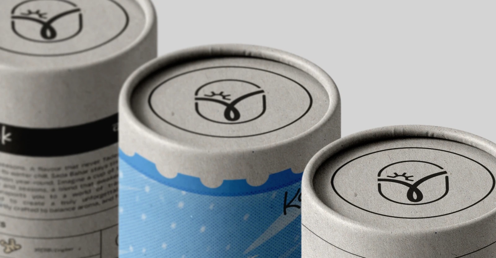 Sairoo tea tube caps close-up — logomark embossed on kraft lids